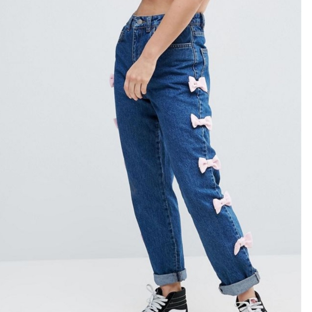 ASOS high waisted blue jeans with pink bow details
